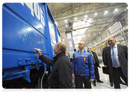 Prime Minister Vladimir Putin visits the Tikhvin train carriage factory to attend the launch ceremony for serial production