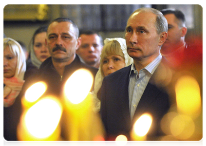 Prime Minister Vladimir Putin attends Christmas service at the Transfiguration Cathedral in St Petersburg