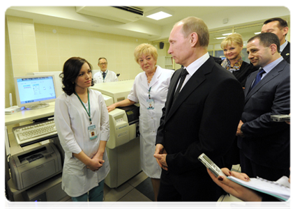 Prime Minister Vladimir Putin on a visit to an accident and emergency hospital
