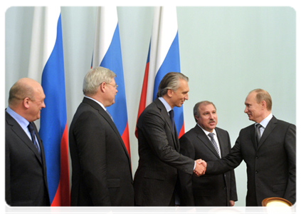 Prime Minister Vladimir Putin attends the signing ceremony for the partnership agreement to develop Tom Football Club