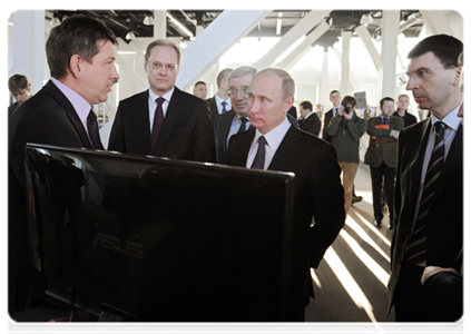 Prime Minister Vladimir Putin visiting the Novosibirsk Academic Town Technology Park where he examined displays of resident companies