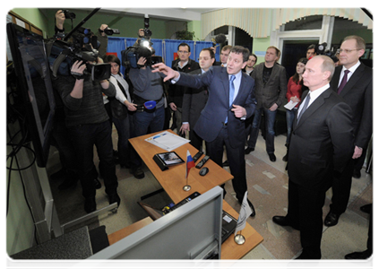 Prime Minister Vladimir Putin visits polling station in Novosibirsk