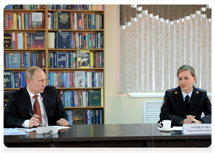 Prime Minister Vladimir Putin and Police Lieutenant Kristina Archibasova, an inspector at the truant office of Police Department No. 2 of the Barnaul City Interior Department