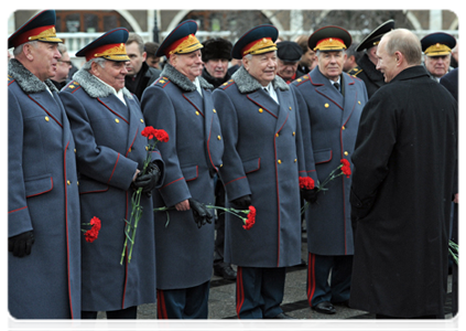 Prime Minister Vladimir Putin attends a wreath-laying ceremony on Defender of the Fatherland Day at the Tomb of the Unknown Soldier in Moscow