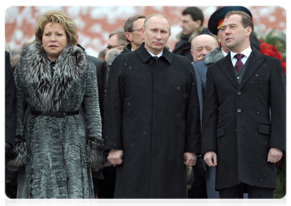 Federation Council Speaker Valentina Matviyenko, Prime Minister Vladimir Putin and President Dmitry Medvedev at a wreath-laying ceremony on Defender of the Fatherland Day at the Tomb of the Unknown Soldier in Moscow