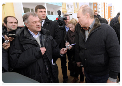 In Astrakhan, Prime Minister Vladimir Putin inspects a new block of flats provided to the residents of a building that was damaged by an explosion