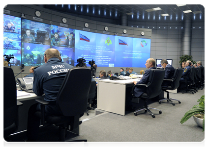 Prime Minister Vladimir Putin holds a teleconference on the extreme cold in some regions at the National Crisis Management Centre under the Emergencies Ministry