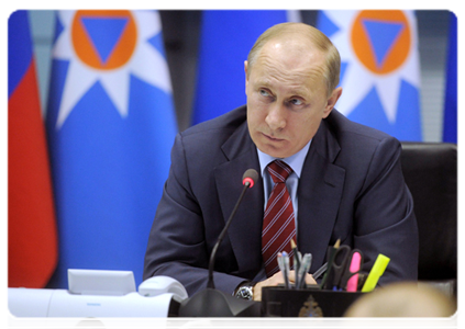 Prime Minister Vladimir Putin holds a teleconference on the extreme cold in some regions at the National Crisis Management Centre under the Emergencies Ministry