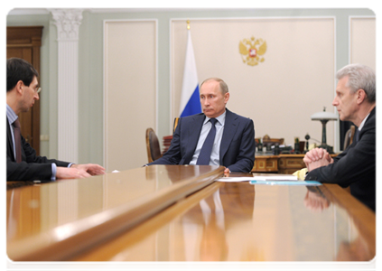 Prime Minister Vladimir Putin holds at a working meeting with Minister of Communications and Mass Media Igor Schyogolev and Minister of Education and Science Andrei Fursenko