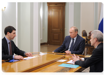 Prime Minister Vladimir Putin holds at a working meeting with Minister of Communications and Mass Media Igor Schyogolev and Minister of Education and Science Andrei Fursenko