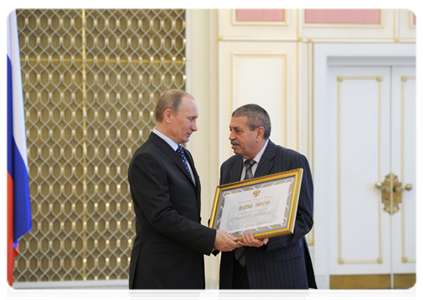 Prime Minister Vladimir Putin awards government certificates of appreciation at the meeting devoted to the 20th anniversary of the Russian Trilateral Commission on the Regulation of Social and Labour Relations