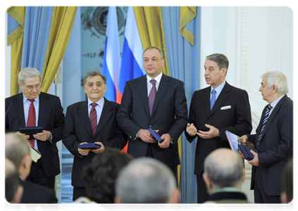 Prime Minister Vladimir Putin attends the award ceremony for the 2011 Russian Government Prizes in Culture. Minister of Culture Alexander Avdeyev presents the prizes