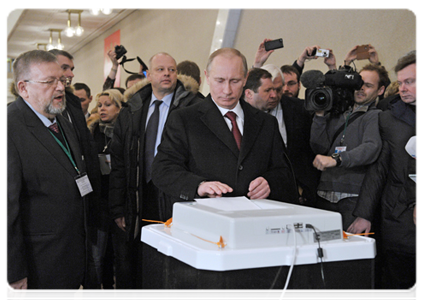 Prime Minister Vladimir Putin votes in the Russian presidential elections