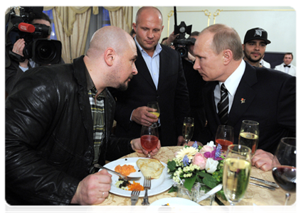 Vladimir Putin, musician Sergei Trofimov and many-time world mixed martial arts champion, Fyodor Yemelyanenko
