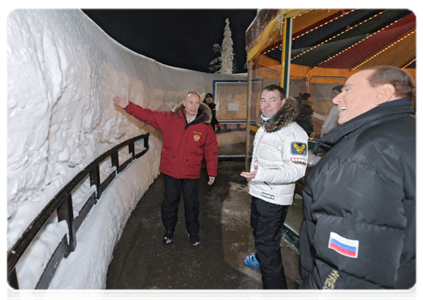 Dmitry Medvedev and Vladimir Putin meet with former Italian Prime Minister Silvio Berlusconi at the Krasnaya Polyana alpine ski resort