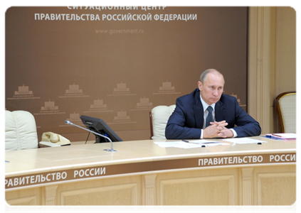 Prime Minister Vladimir Putin holding a video conference on the completion of the bridge across the Eastern Bosporus Strait as part of preparations for APEC-2012 Leaders Week, and on wildfires in the Trans-Baikal Territory