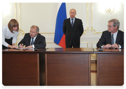 Prime Minister Vladimir Putin attends the signing of a series of agreements between Rosneft and US ExxonMobil