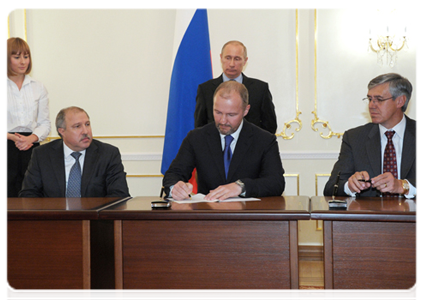 Prime Minister Vladimir Putin attends the signing of a series of agreements between Rosneft and US ExxonMobil