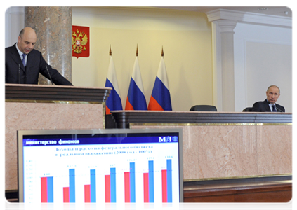 Prime Minister Vladimir Putin and Finance Minister Anton Siluanov at an extended meeting of the Finance Ministry Board