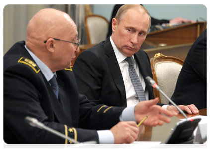 Prime Minister Vladimir Putin and Head of the Well Drilling Department at the St Petersburg State Mining University Nikolai Vasilyev
