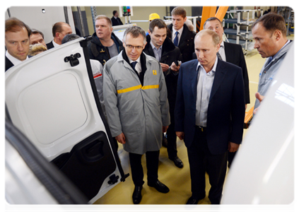 Prime Minister Vladimir Putin examines the production of the new Lada Largus model at AvtoVAZ