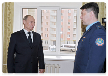 Prime Minister Vladimir Putin inspects new building for servicemen in Engels