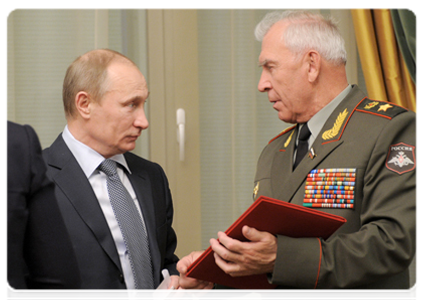 Prime Minister Vladimir Putin and Chairman of the Council of the National Public Organisation of Russian Armed Forces Veterans Mikhail Moiseyev
