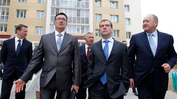 Prime Minister Dmitry Medvedev tours a new housing development