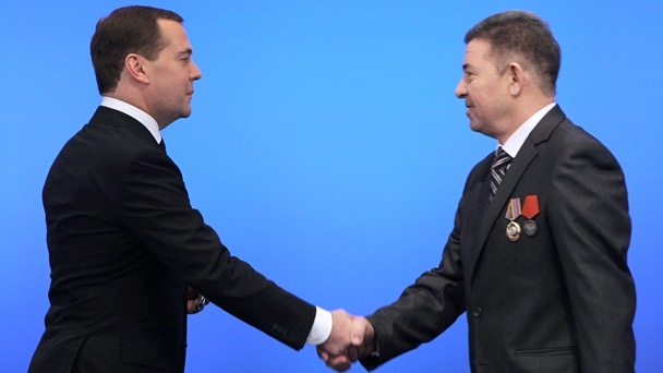 Prime Minister Dmitry Medvedev awards an Order of Honour to Magsum Khaliullin, a lathe turner at the Chelyabinsk electro-mechanical factory